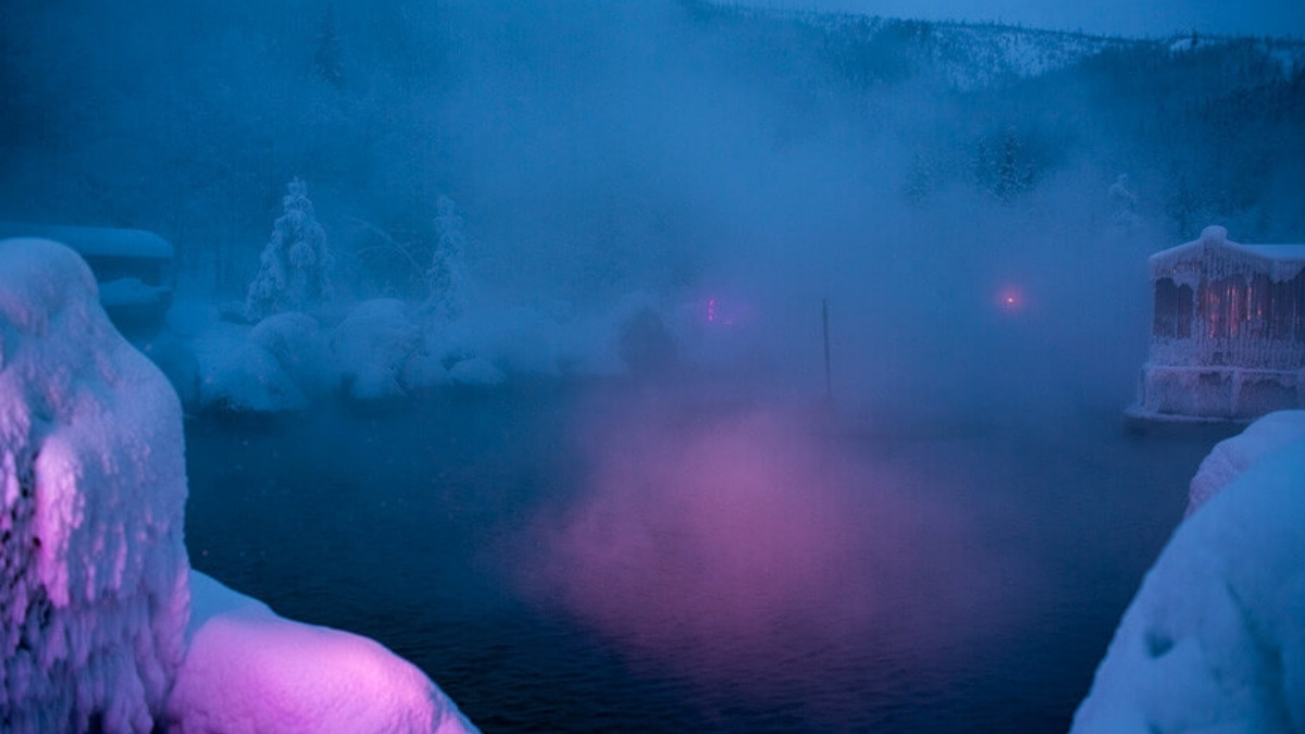 Chena Hot Springs, Alaska, with Aurora Borealis overhead.