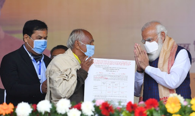 Prime Minister Modi gives out land allotment certificates to indigenous people in Assam