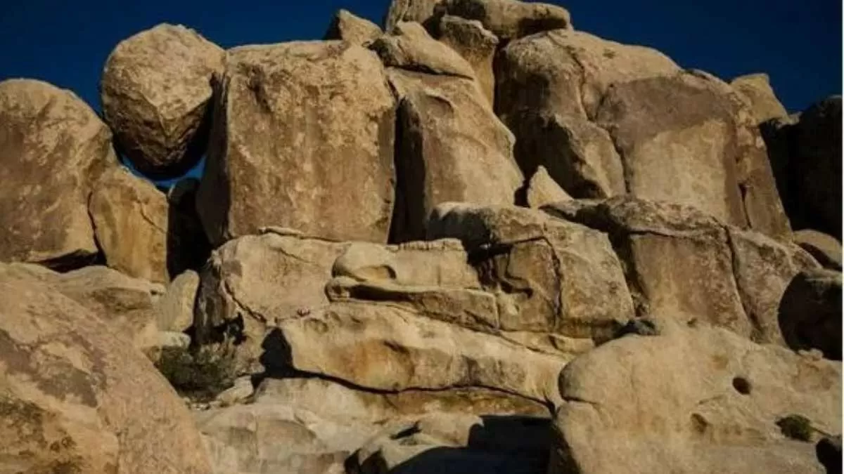 Find Hidden Girl in Rock Optical Illusion