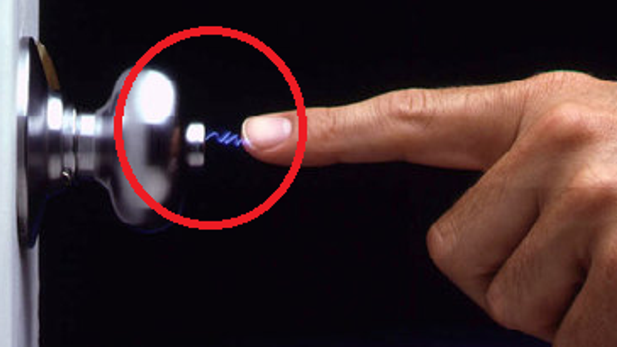 Why you feel little electric jerk when you touch something?